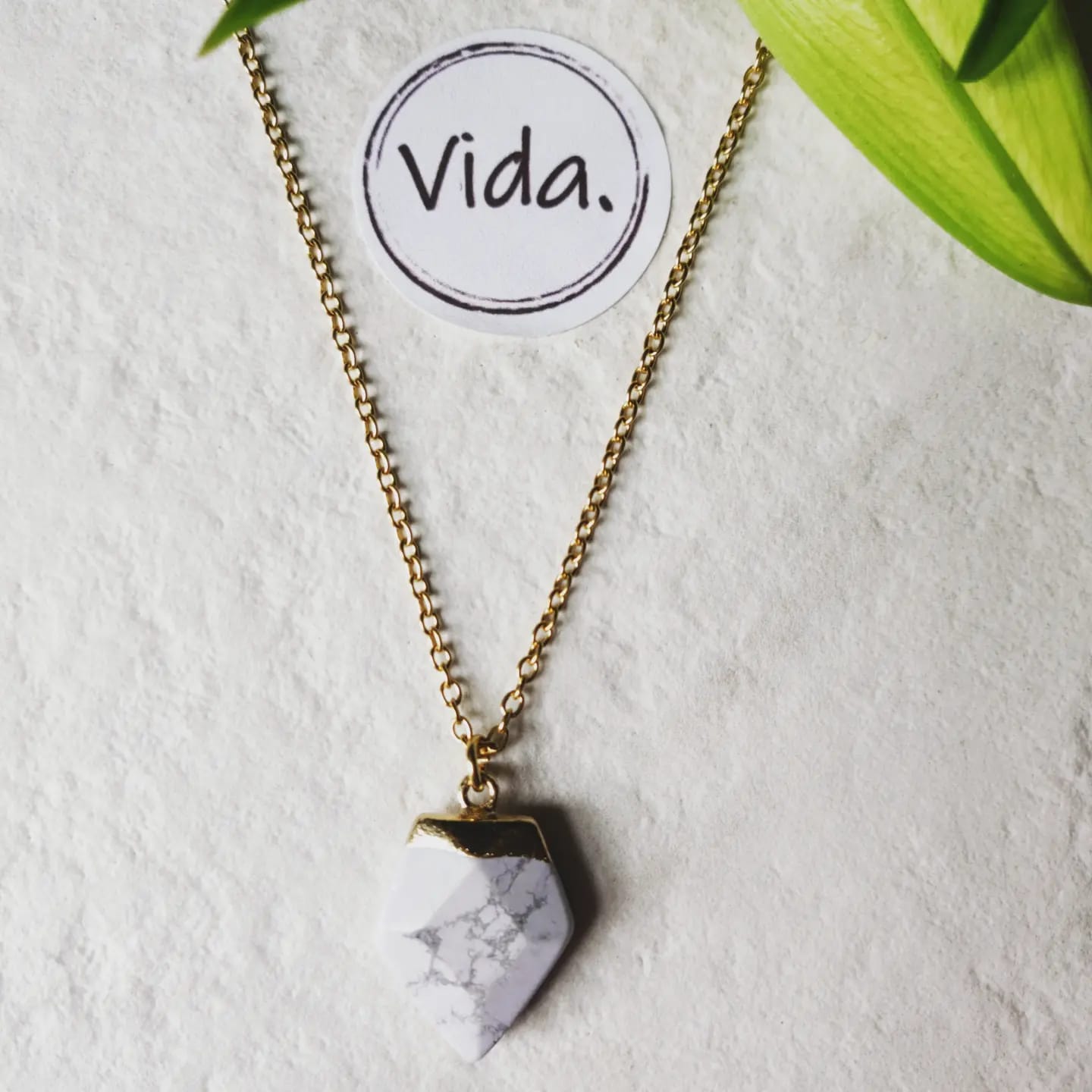 Howlite Crystal Arrow on Gold Tone Stainless Steel Necklace