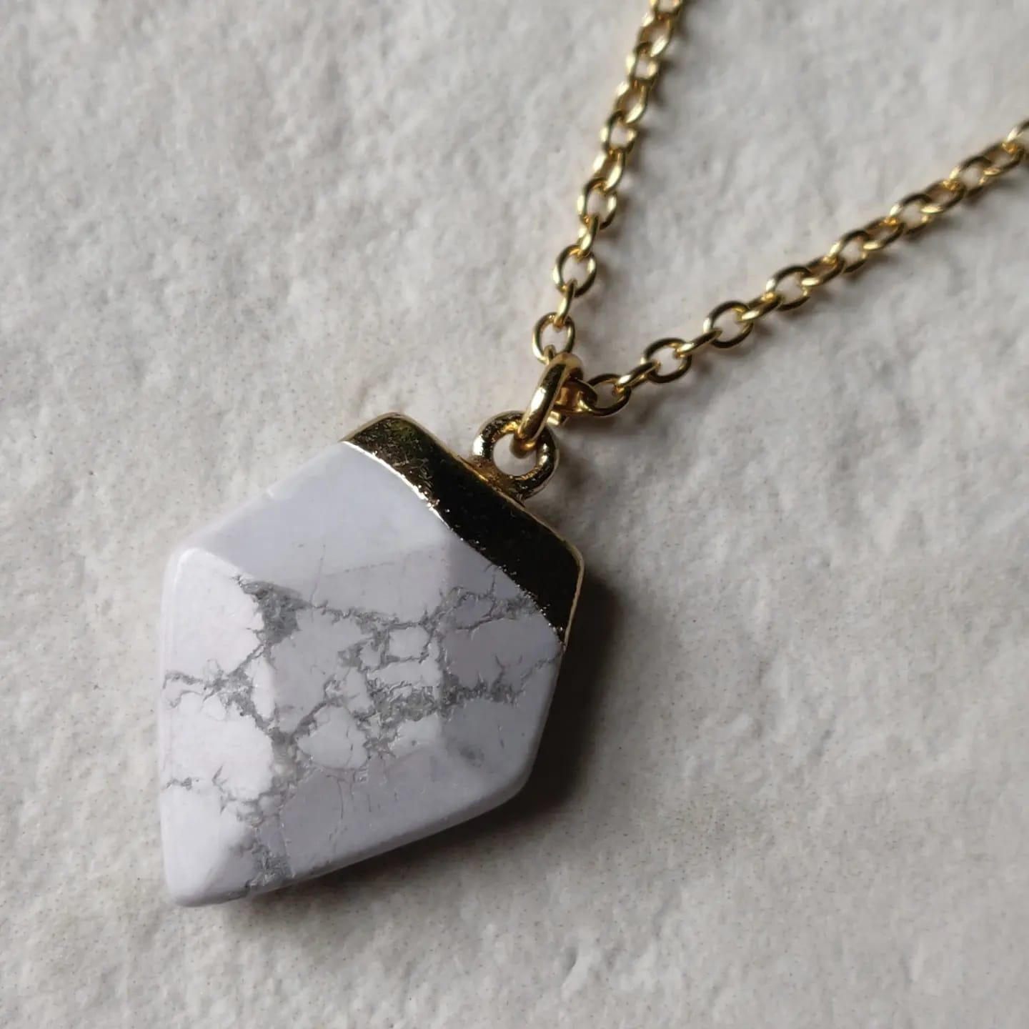 Howlite Crystal Arrow on Gold Tone Stainless Steel Necklace